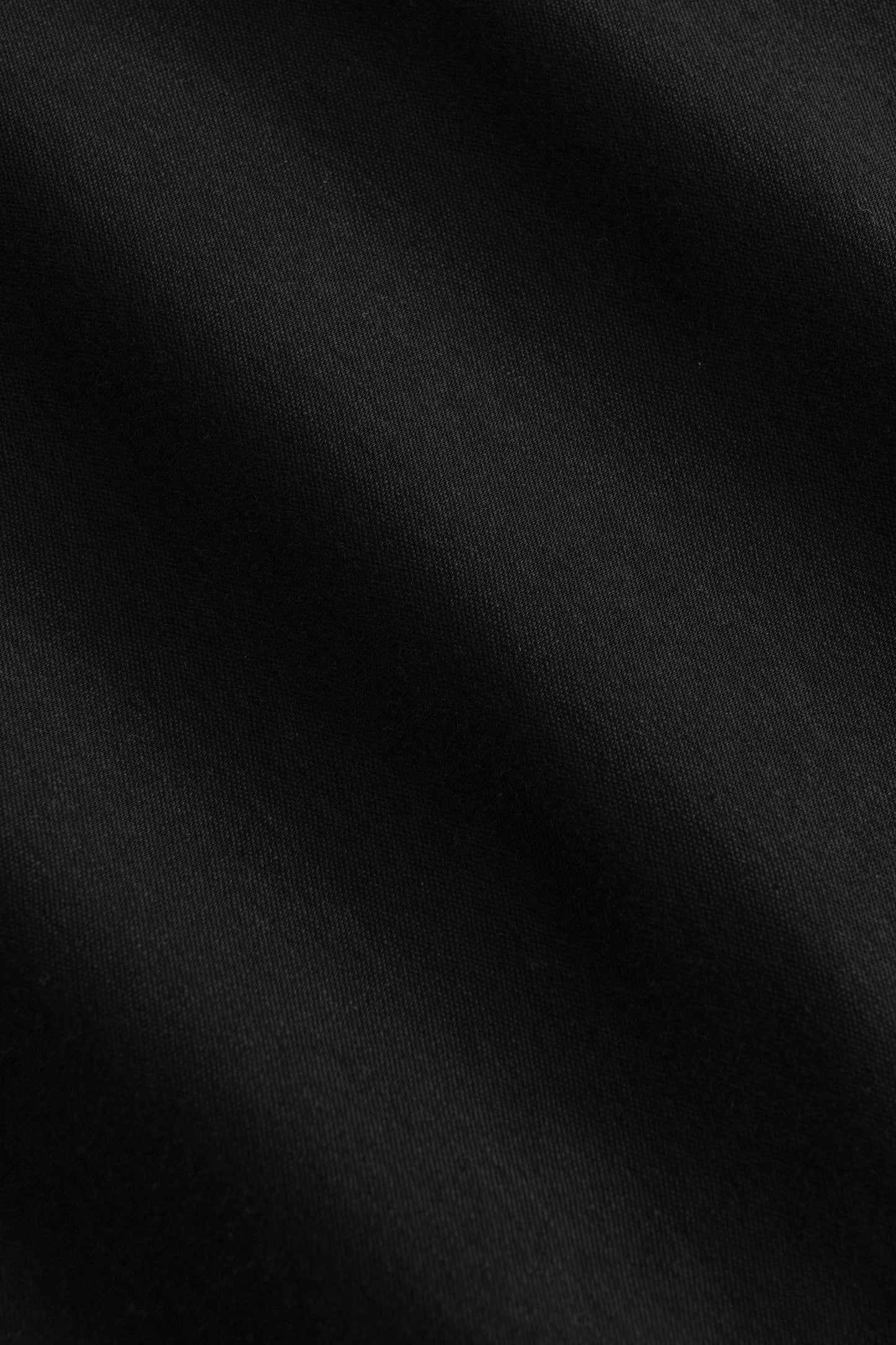 Black crew neck sock with ribbed knit texture.