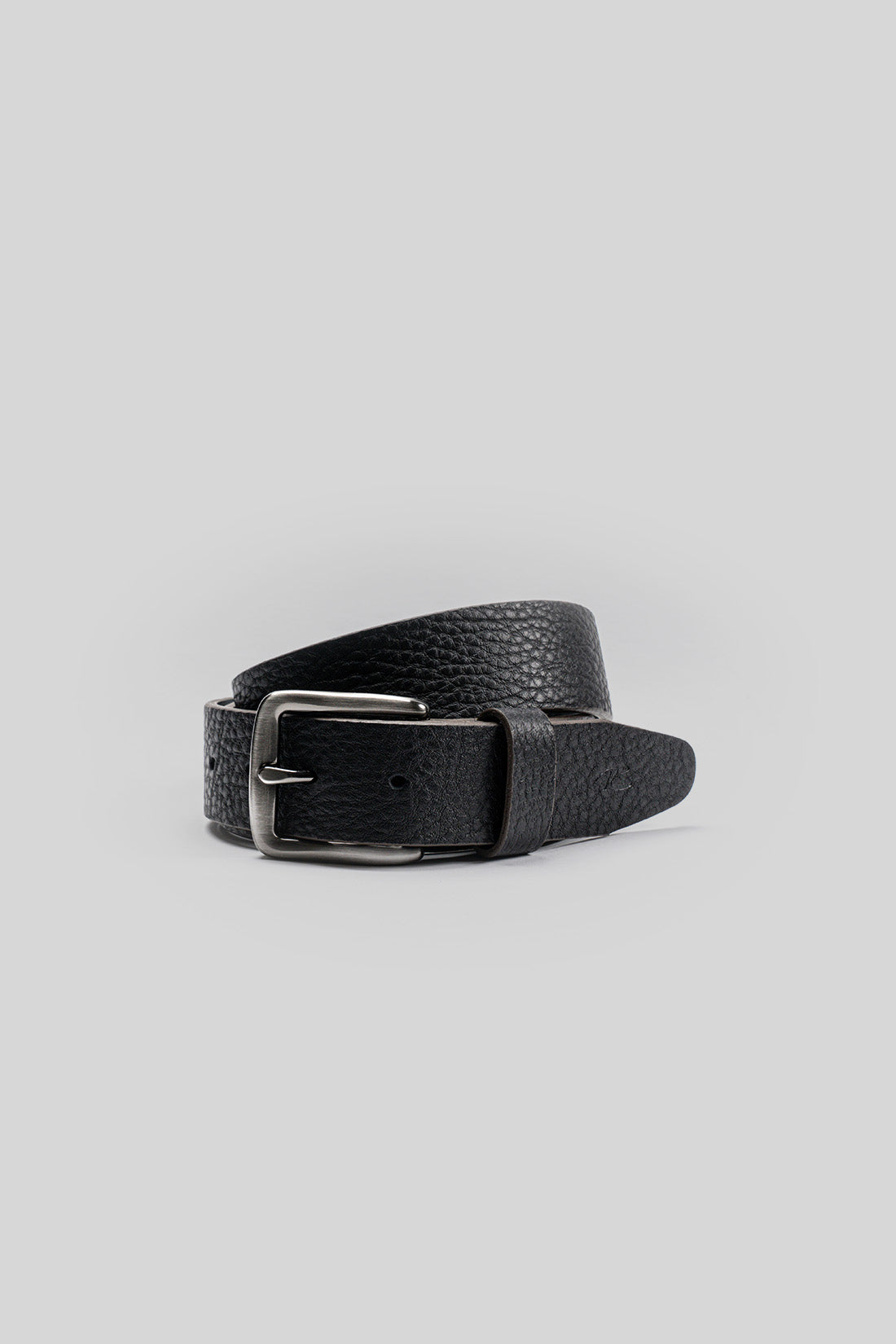 Black leather belt with textured surface and silver-toned rectangular buckle.