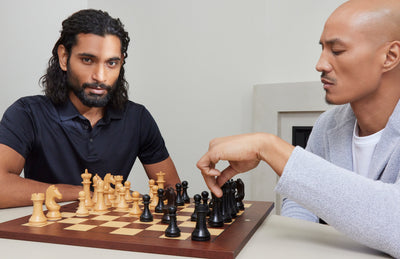 two men wearing robert barakett clothing playing chess