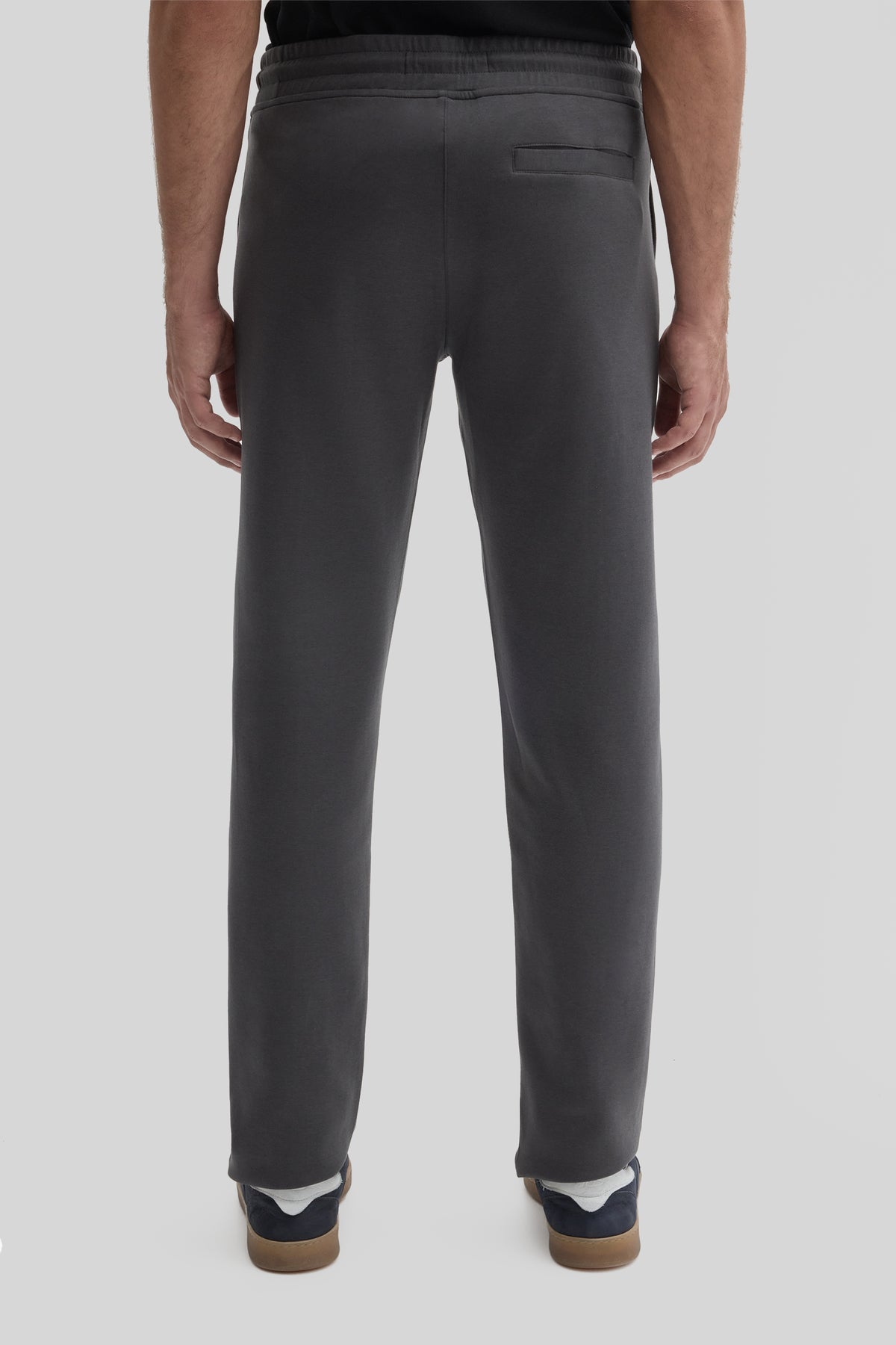 Charcoal jogging pants with drawstring waist, back pocket, and color-blocked cuffs in navy and tan.
