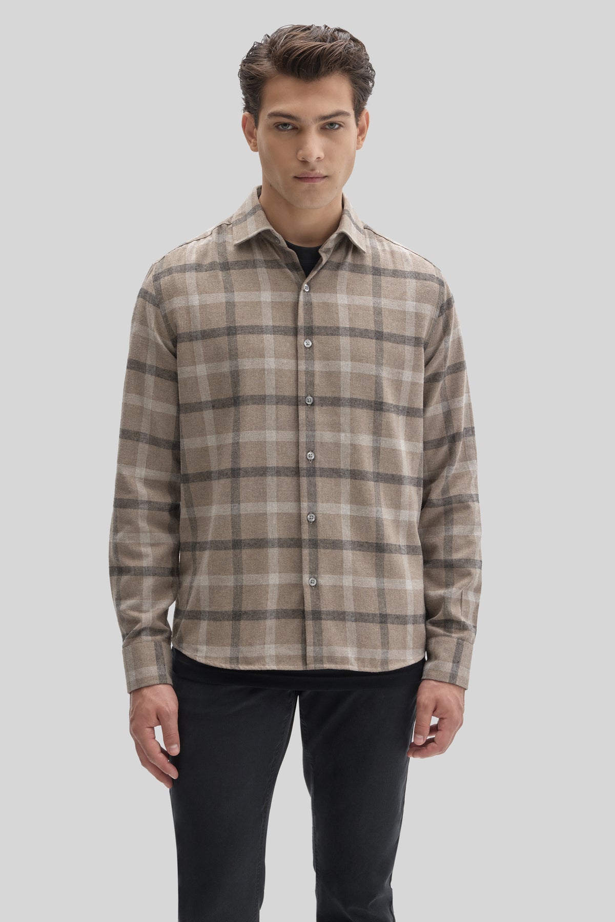 Men's beige and gray plaid flannel shirt with button front and collar.