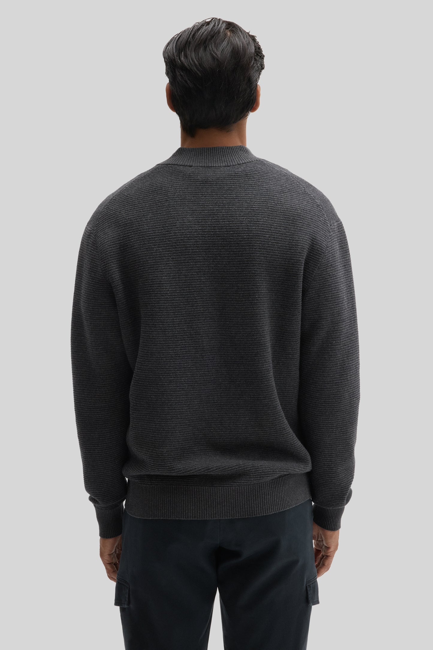 Charcoal gray ribbed quarter zip sweater on model shown from back view.