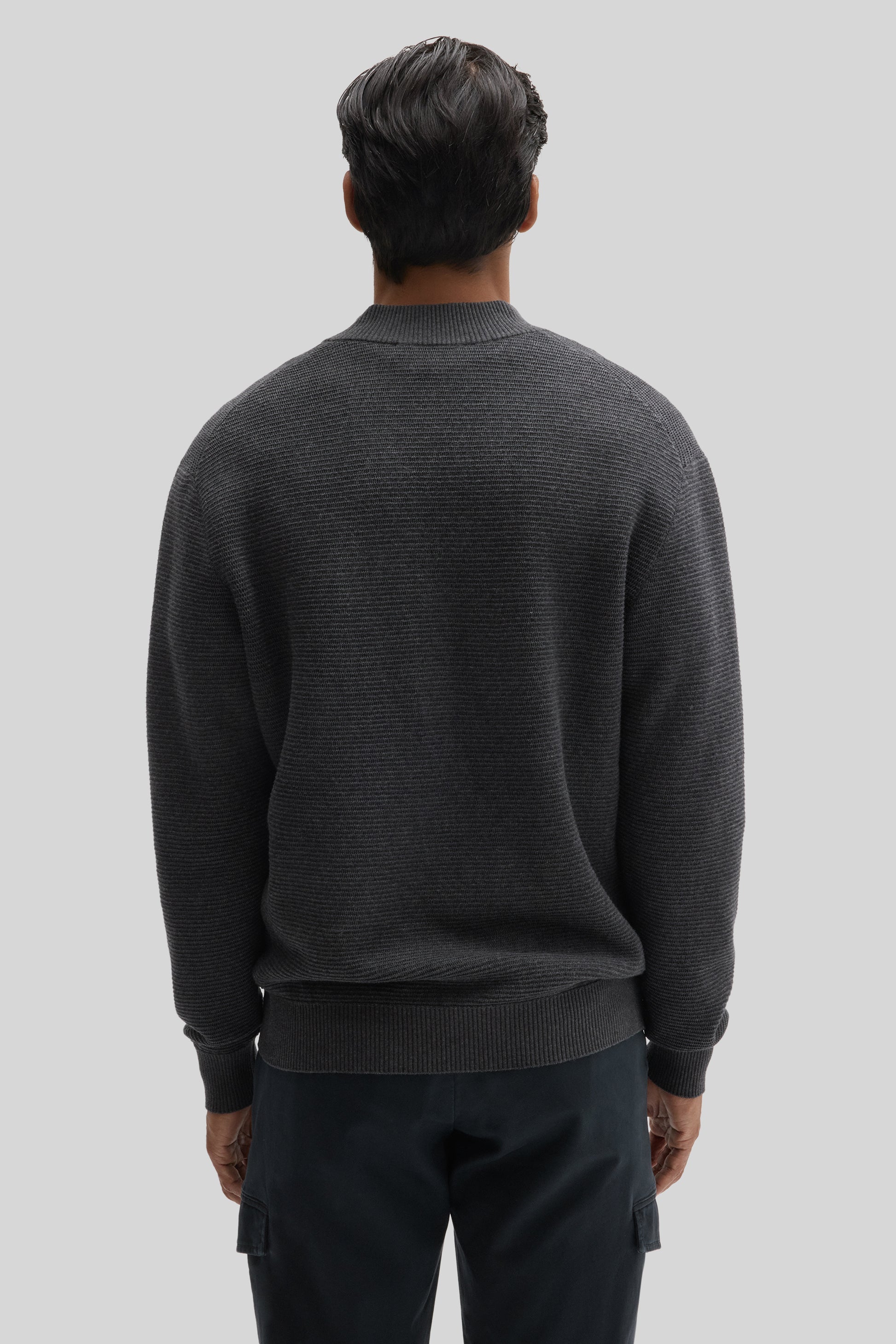 Charcoal gray ribbed quarter zip sweater on model shown from back view.