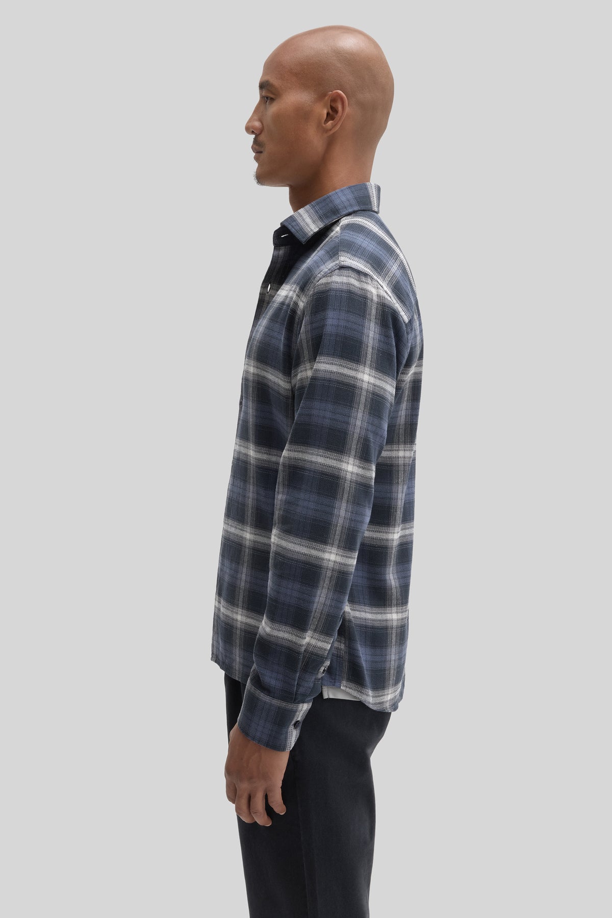Blue and white plaid corduroy button-up shirt with long sleeves and spread collar.