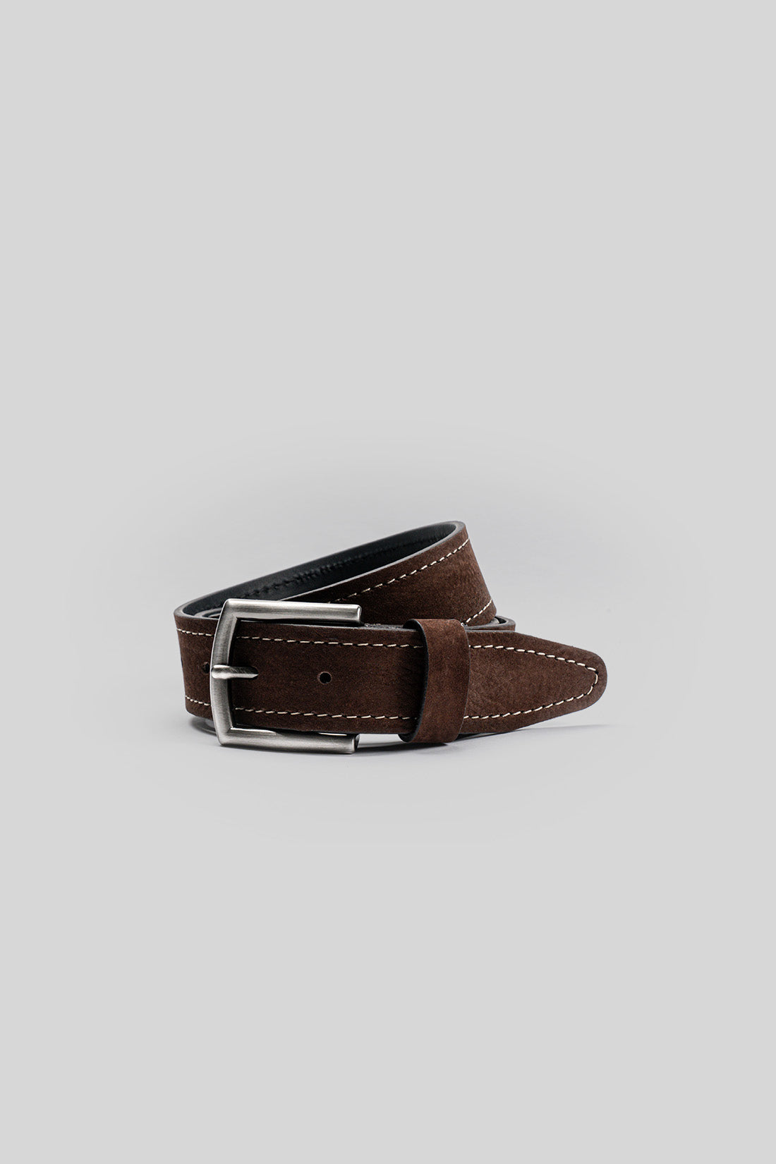 Brown leather belt with white topstitching and rectangular silver buckle.